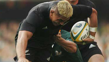 Jerry Collins charges into Tony Woodcock