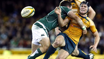 Paddy Wallace puts in a nice hit on Berrick Barnes